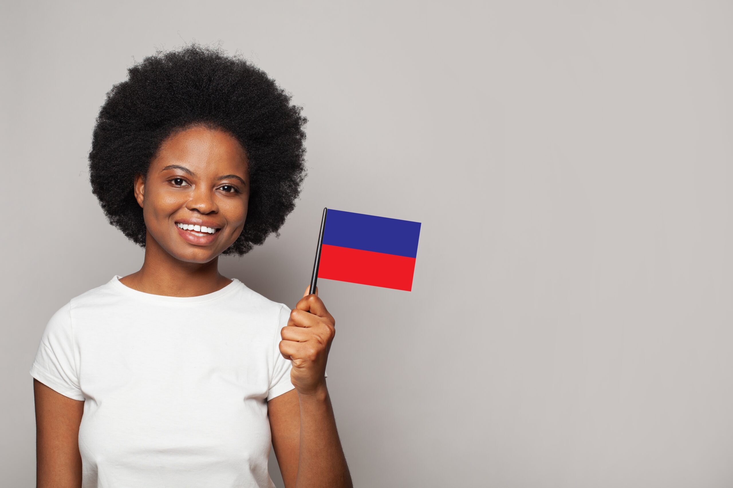 Haitian,Woman,Holding,Flag,Of,Haiti,Education,,Business,,Citizenship,And